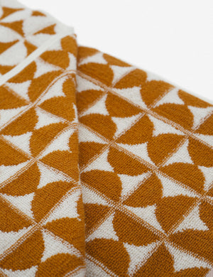 Close-up of the Harper orange and white towel by house number 23 with orange half-moon designs