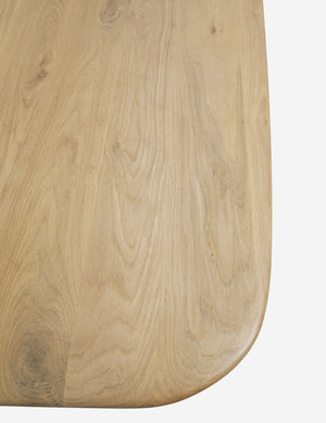 The rounded edge on the corner of the Henrik light wood dining table