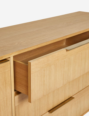 The top drawer of the Hillard white oak veneer five drawer sideboard open