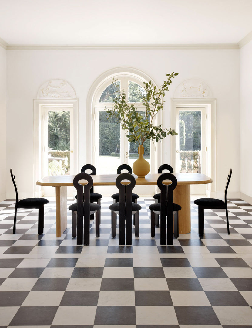#color::natural #size::96-W | Archer Natural Rectangular Dining Table sits in dining room a checkerboard floor and is surrounded by sculptural chairs