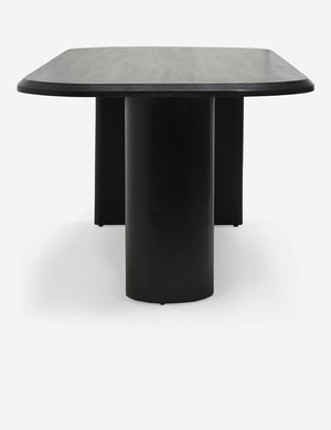 Cylindrical-leg side of the Archer Black Rectangular Dining Table