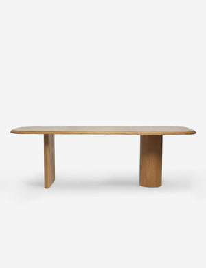 Archer Natural Rectangular Dining Table with a flat slab-style leg and a cylindrical leg by Sarah Sherman Samuel
