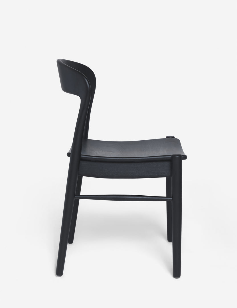 #color::Black | Side view of the Ida black teak wood dining chair.