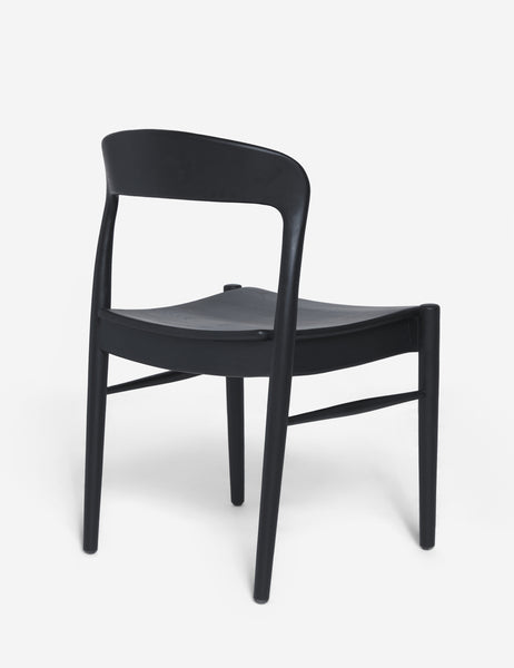#color::Black  | Angled rear view of the Ida black teak wood dining chair.