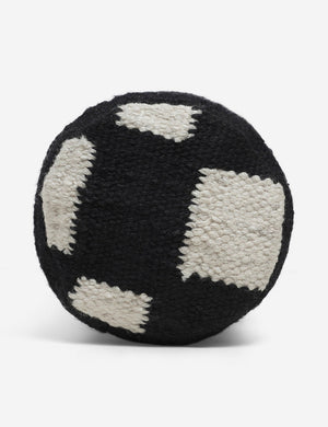 Side view of the Irregular black and white Checkerboard Bolster Pillow by Sarah Sherman Samuel