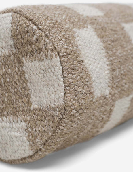#color::taupe | Angled close up of the Irregular taupe and white Checkerboard Bolster Pillow by Sarah Sherman Samuel
