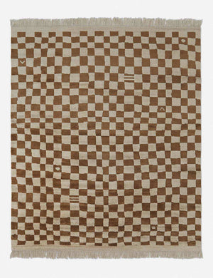 Irregular ochre checkerboard rug by Sarah Sherman Samuel