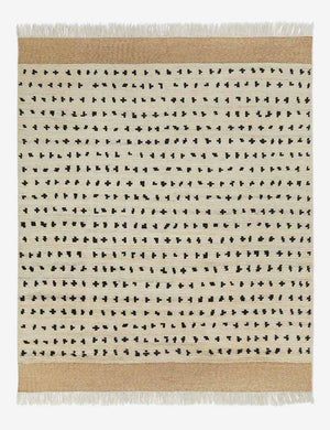 Irregular dots ivory rug with a mixed dot motif and brown flatwoven border with fringe by Sarah Sherman Samuel