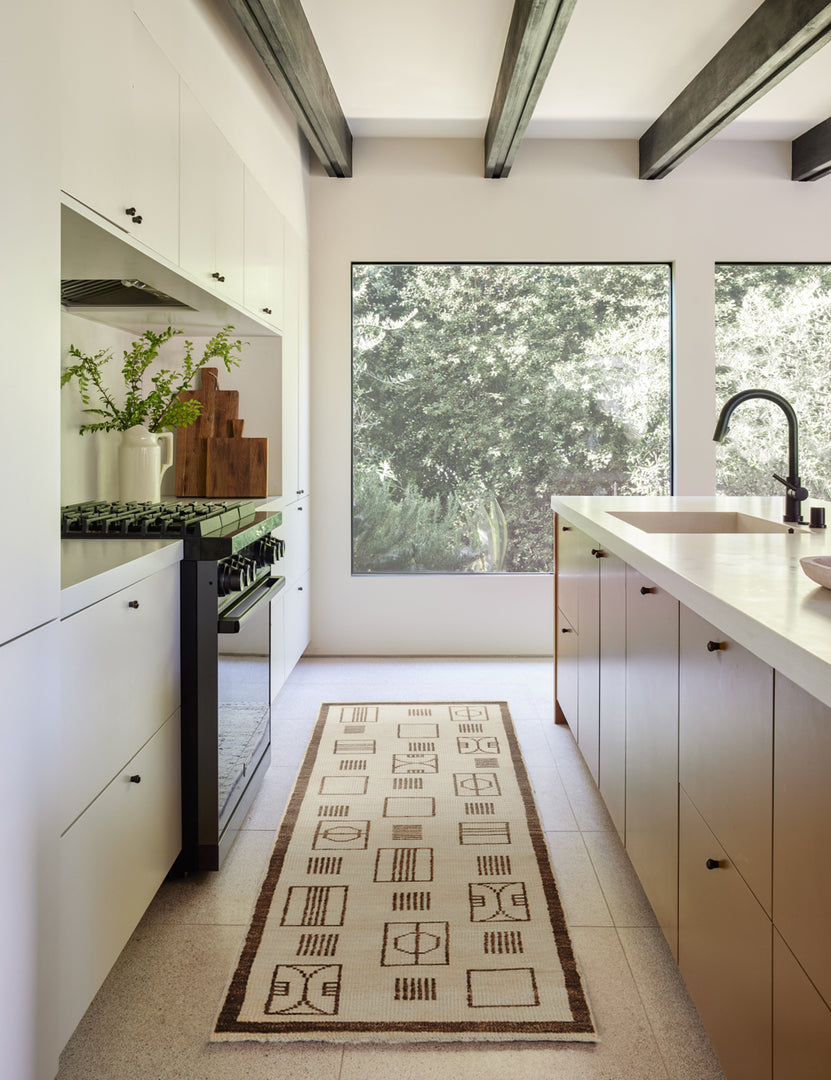 #size::2-6--x-8- | The jillian runner rug lays in a kitchen with black hardware, white cabinetry and countertops, and a wooden beamed ceiling