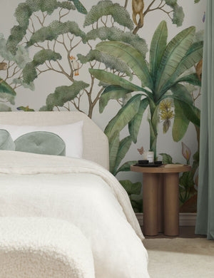 Green Jungle Wallpaper Mural used as an accent wall in a bedroom.
