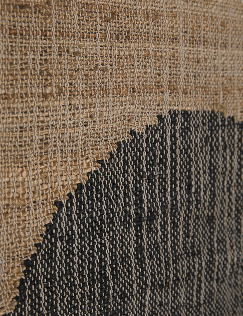 | Close-up of the flat weave fabric on the Katlee black and natural flat weave Wall Hanging