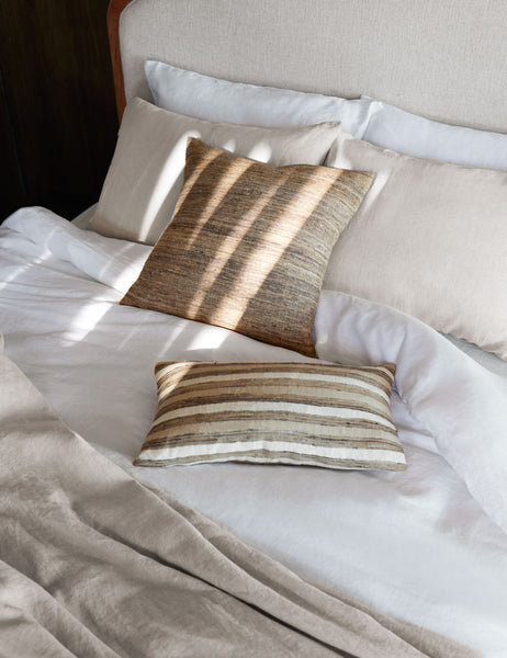 #color::white #size::queen #size::king #size::twin #size::cal-king | The European Flax Linen white Duvet Set by Cultiver lays on a cream linen and wooden framed bed with brown patterned throw pillows and natural toned linens