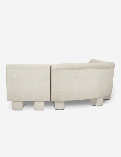 #color::Ivory-Boucle #configuration::right-facing #size::142-W | Rear view of the side of the Lena right-facing white boucle sectional sofa with upholstered beam legs.