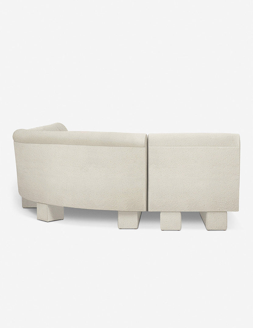 #color::Ivory-Boucle #configuration::left-facing #size::142-W | Rear view of the side of the Lena left-facing white boucle sectional sofa with upholstered beam legs.