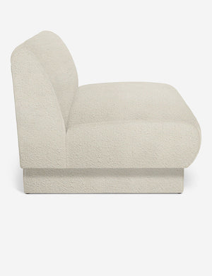 Side view of the Centerpiece of the white boucle sectional sofa with upholstered beam legs