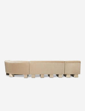 Rear view of the entire Lena right-facing beige velvet sectional sofa with upholstered beam legs.