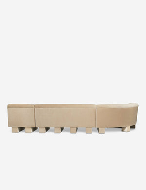 Rear view of the entire Lena left-facing beige velvet sectional sofa with upholstered beam legs.
