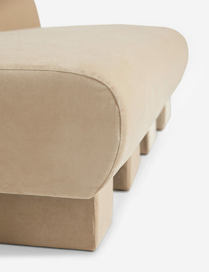 Close-up of the side of the Lena armless brie beige velvet sofa