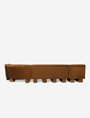 Rear view of the entire Lena right-facing cognac velvet sectional sofa with upholstered beam legs.