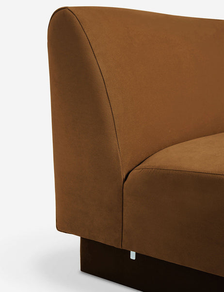 #color::Cognac-velvet #configuration::left-facing #configuration::right-facing #size::142-W #size::114-W | Close-up of the Centerpiece of the Lena cognac velvet sectional sofa with upholstered beam legs