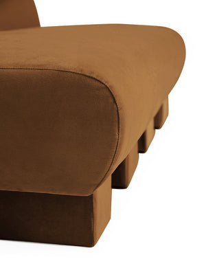 Close-up of the side of the Lena Cognac Velvet armless sofa
