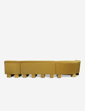Rear view of the entire Lena left-facing yellow velvet sectional sofa with upholstered beam legs.