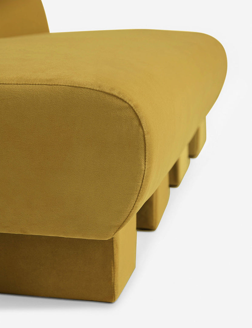 #color::Goldenrod-Velvet | Close-up of the side of the Lena Goldenrod Velvet armless sofa