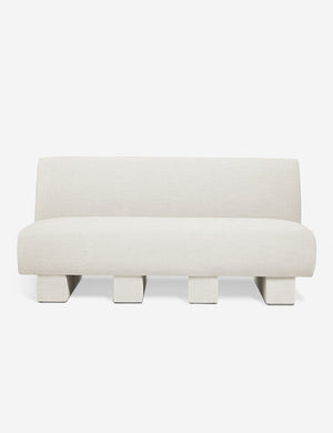 Centerpiece of the Lena natural linen sectional sofa with upholstered beam legs