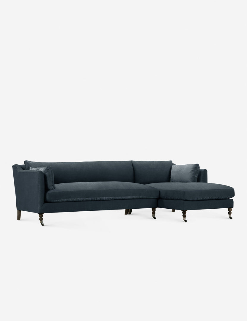 #color::blue #configuration::right-facing | Fabienne left-facing blue velvet sectional with antique curved legs in the back with ornate turned legs in the front with wheels