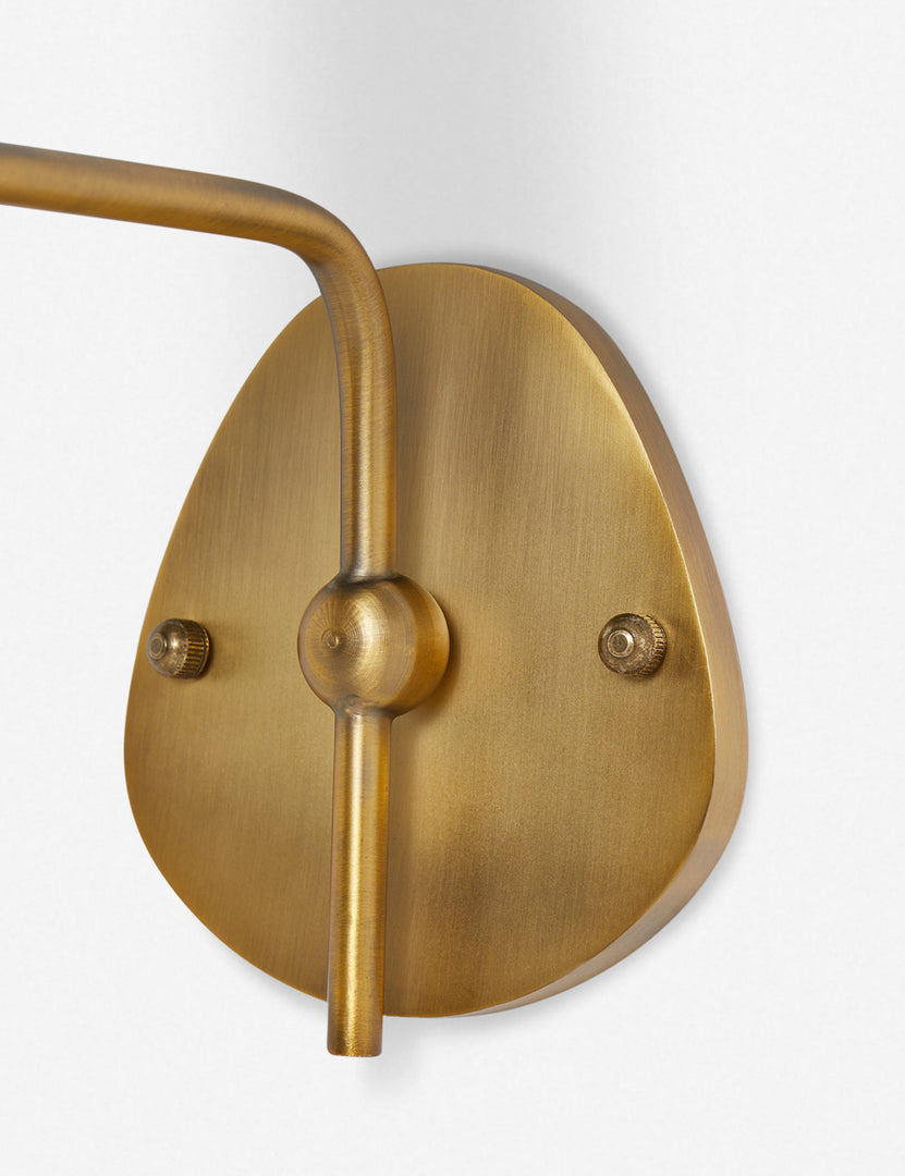 #color::white #finish::brass | Close up of the wall mount of the Magdalene brass single sconce
