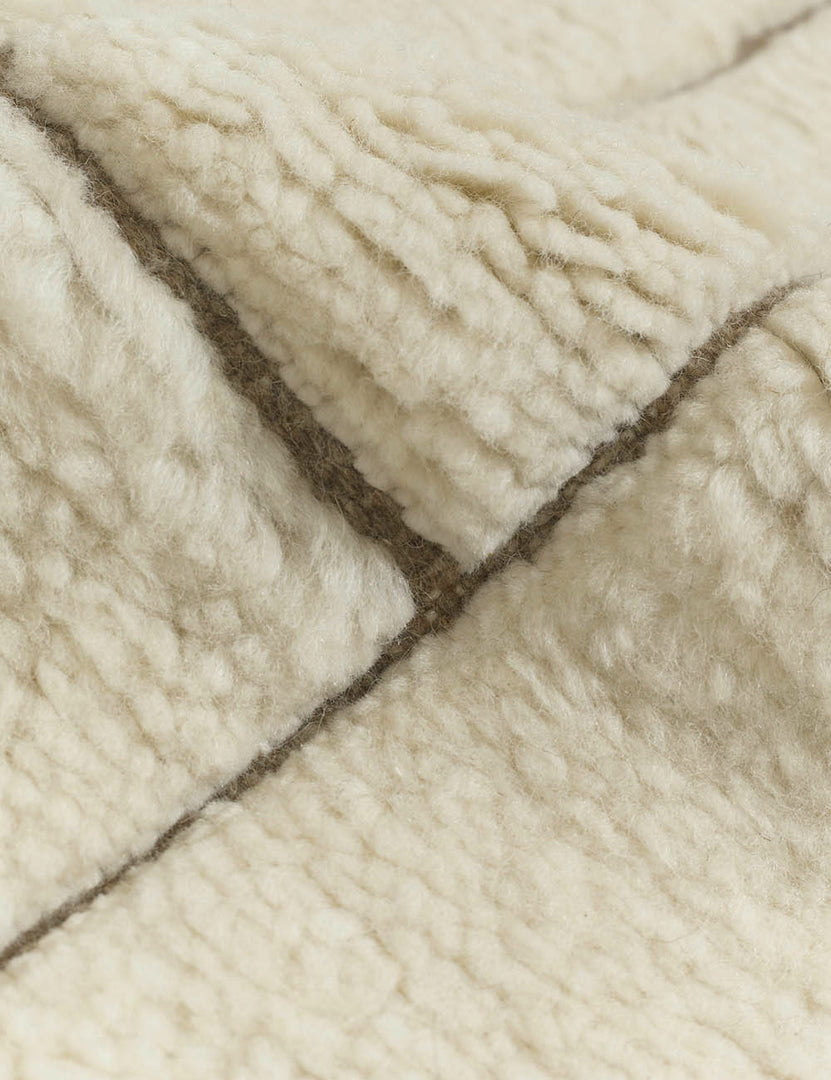 #size::6--x-9- #size::8--x-10- #size::9--x-12- #size::10--x-14- #size::12--x-15- | Close-up of the tufting on the Maleena cream hand-knotted wool and cotton area rug with abstract line tufting