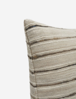 Corner of Marit neutral lumbar silk pillow with striated lines