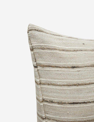 Corner of Marit neutral square silk pillow with striated lines