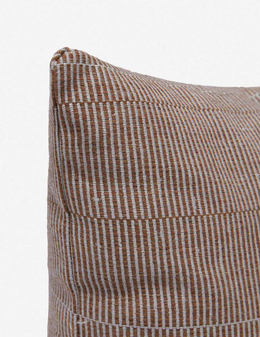 #color::rust #style::lumbar | Corner shot of the Milan indoor and outdoor pillow by Sunbrella