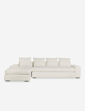 Nadine Ivory performance fabric upholstered left-facing sectional sofa with low, wide arms and tall pillow back cushions