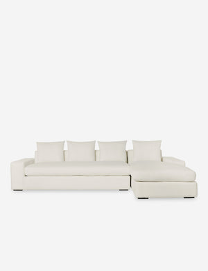 Nadine Ivory performance fabric upholstered right-facing sectional sofa with low, wide arms and tall pillow back cushions