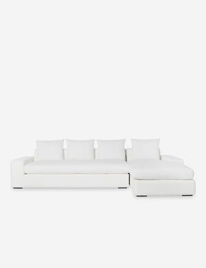 Nadine White performance fabric upholstered right-facing sectional sofa with low, wide arms and tall pillow back cushions