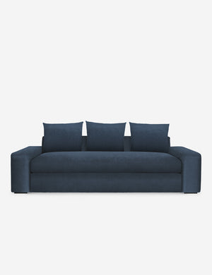 Nadine blue velvet sofa with low, wide arms and tall pillow back cushions