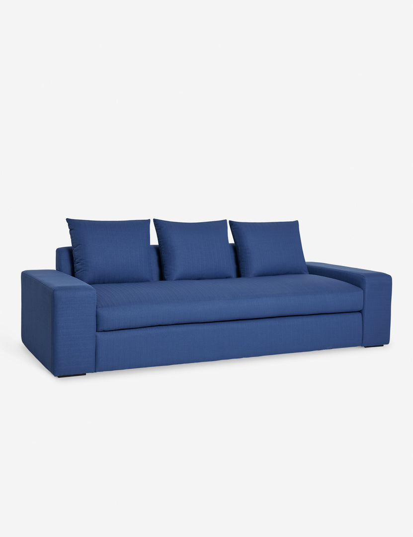 #color::blue-performance-fabric #size::108-W #size::96-W #size::84-W | Angled view of the Nadine blue performance fabric sofa
