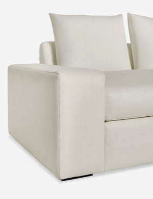 Close up of the low and wide arm and tall cushions on the Nadine ivory performance fabric sofa