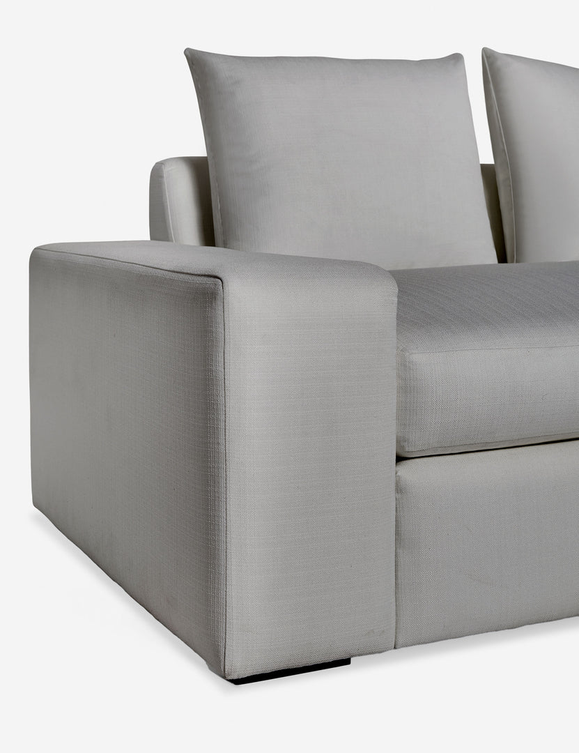 #color::gray-performance-fabric #size::108-W #size::96-W #size::84-W | Close up of the low and wide arm and tall cushions on the Nadine gray performance fabric sofa