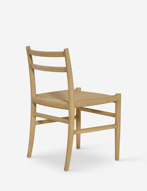 Angled back view of the Nicholson slim natural oak wood frame and woven seat dining chair.