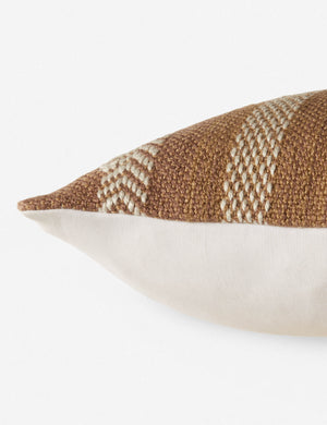 Close up side view of the kamala indoor and outdoor lumbar throw pillow with bohemian accents in taupe