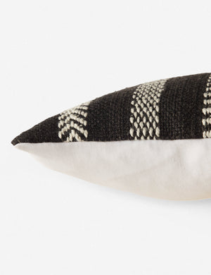Close up side view of the kamala indoor and outdoor lumbar throw pillow with bohemian accents in black