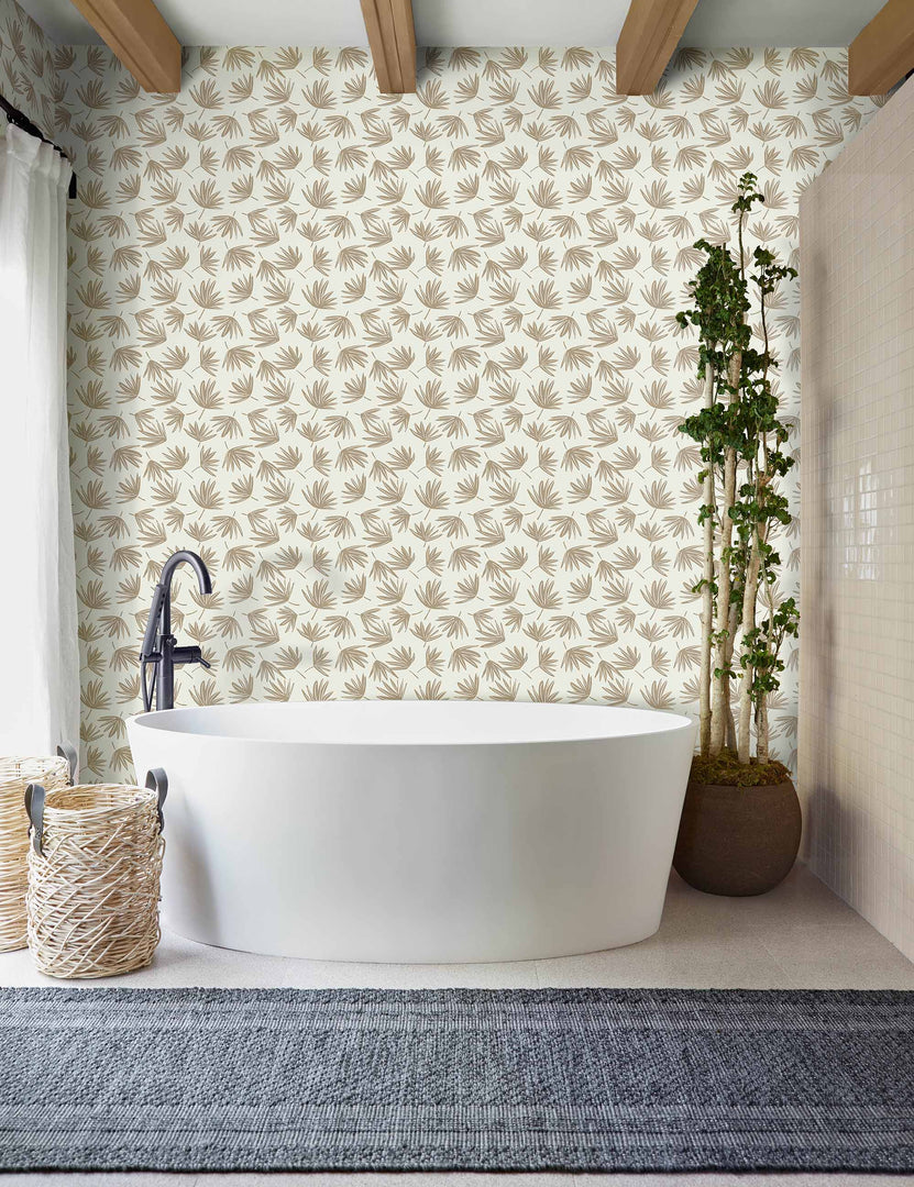 | The palms wallpaper is in a bathroom with a white bathtub, a navy runner rug, and wooden beamed ceilings