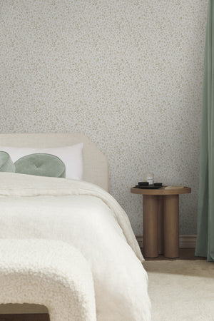 The sommerville natural wallpaper is in a bedroom with a natural linen framed bed, a boucle bench, and wooden night stand