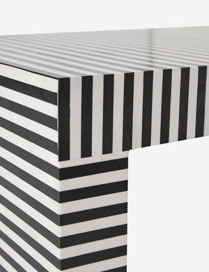 Close up of where the leg and the base of the Prado black and white striped coffee table meet