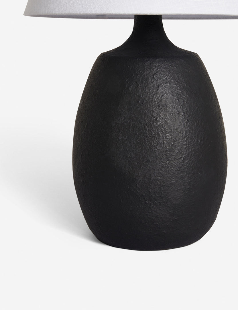 #color::black | The textured rounded base on the Pratt black table lamp