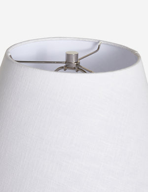 The silver hardware and white linen shade on the top of the Pratt black table lamp