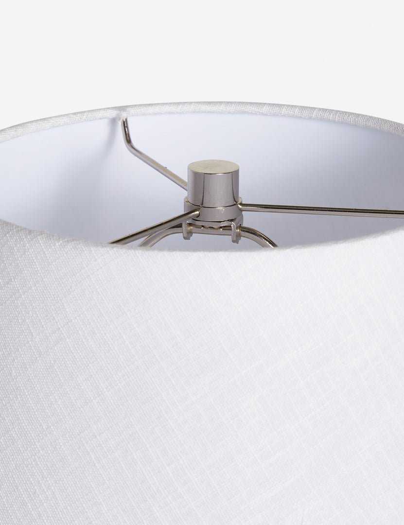 #color::white | The silver hardware and white linen shade on the top of the Pratt white table lamp